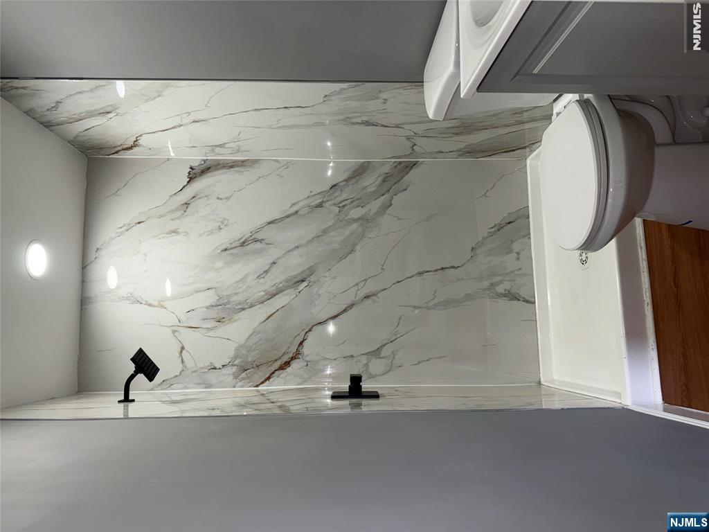 178 Berry Street Hackensack, NJ 07601 - Photo 6 of 22 a bathroom with a sink and toilet