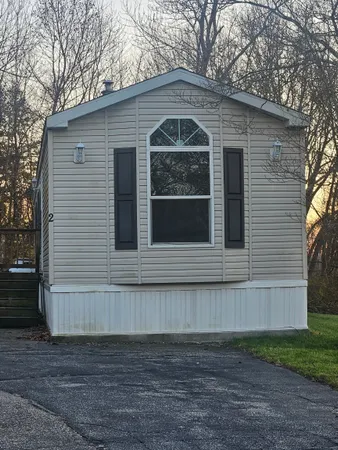 a front view of a house with garage