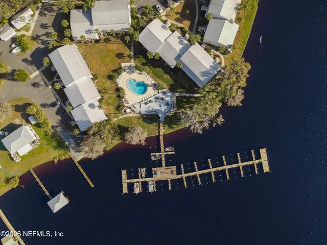 an aerial view of residential houses with outdoor space