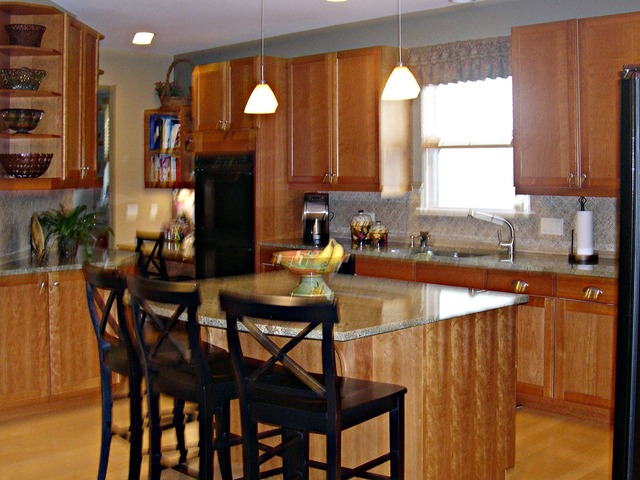 32 Prall's Loop Highwood, IL 60040 - Photo 5 of 10 a kitchen with a table chairs sink and cabinets