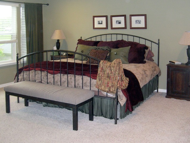 32 Prall's Loop Highwood, IL 60040 - Photo 8 of 10 a bedroom with a bed a lamp and a large window