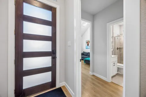 a view of walk in closet with empty room