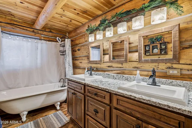 a kitchen with stainless steel appliances granite countertop a stove a refrigerator and a microwave oven