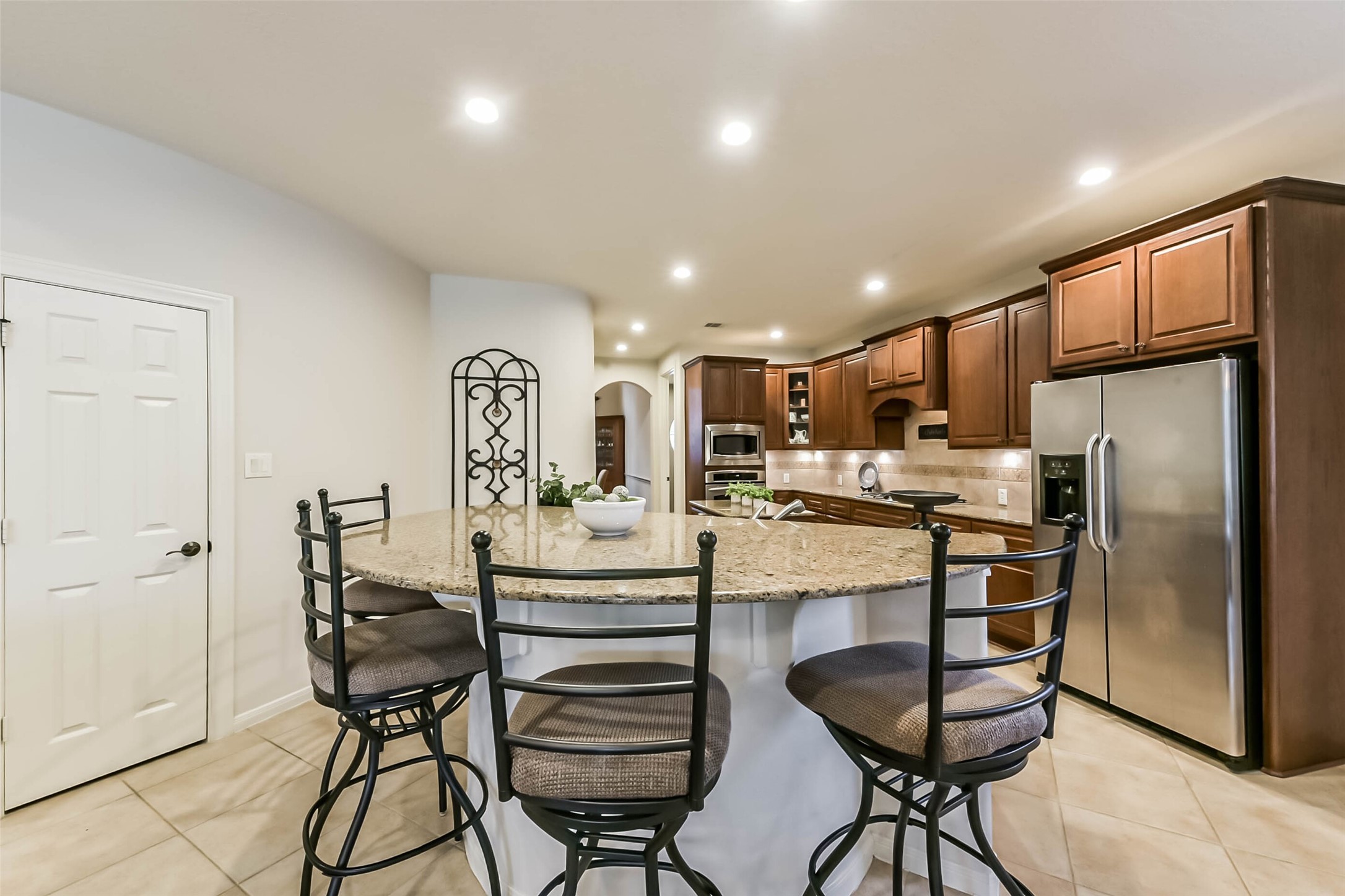 25295 Bull Ridge Drive Porter, TX 77365 - Photo 15 of 49 Large island bar. Walk in pantry to the left. - open kitchen to Family Room