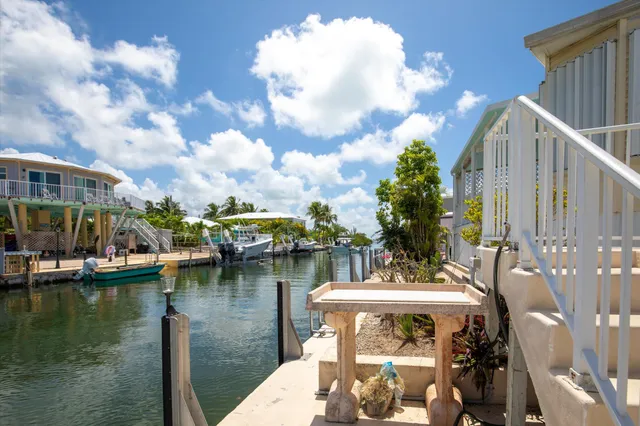 a view of a lake with a house in the background