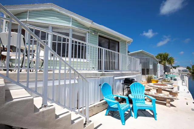 a view of a lake with furniture