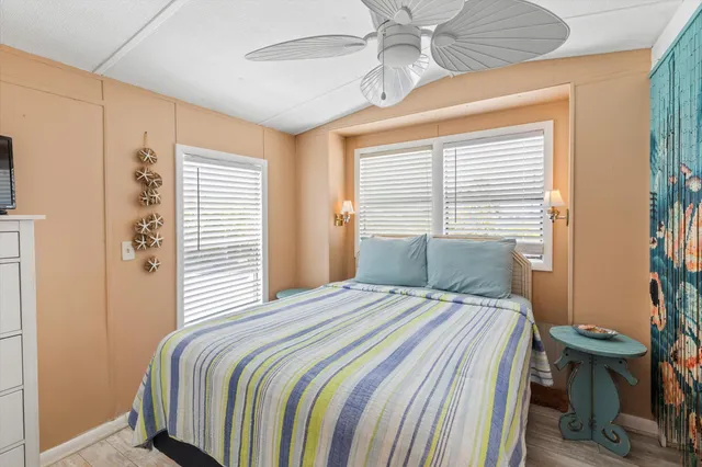 a bedroom with a bed and window