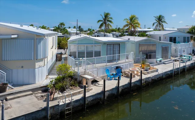 a view of a street with a cars parked in front of it