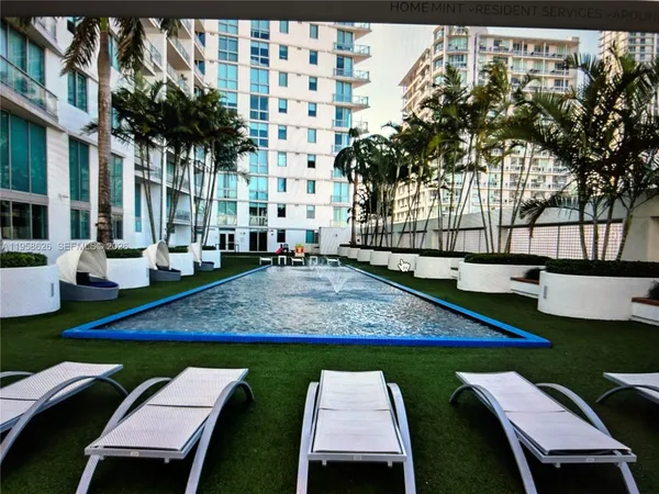 a view of a patio with swimming pool