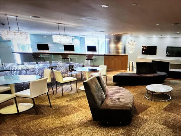 a living room with furniture a rug and a fireplace