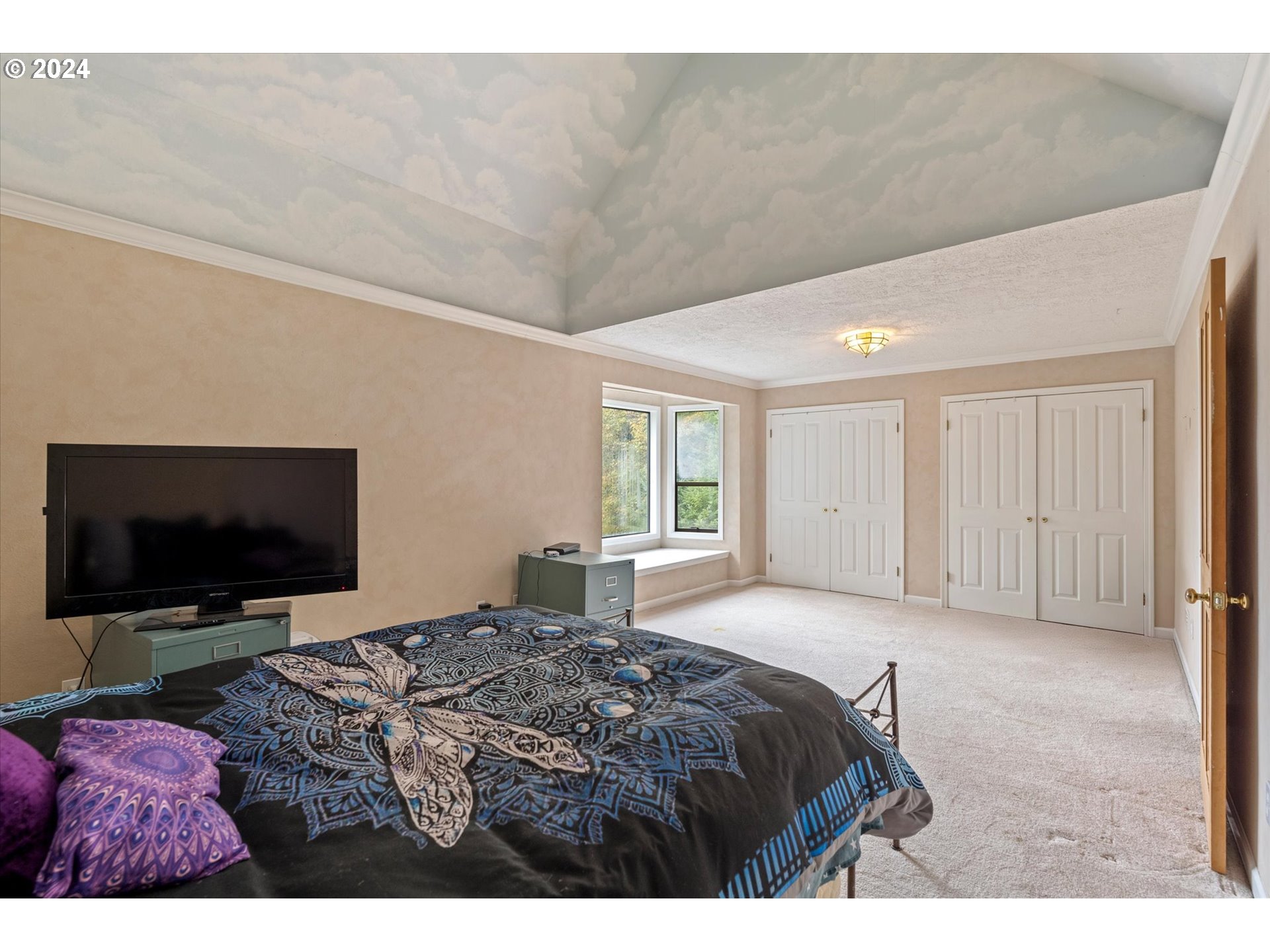 3516 Sunset Way Longview, WA 98632 - Photo 20 of 37 a bedroom with a bed and a flat screen tv