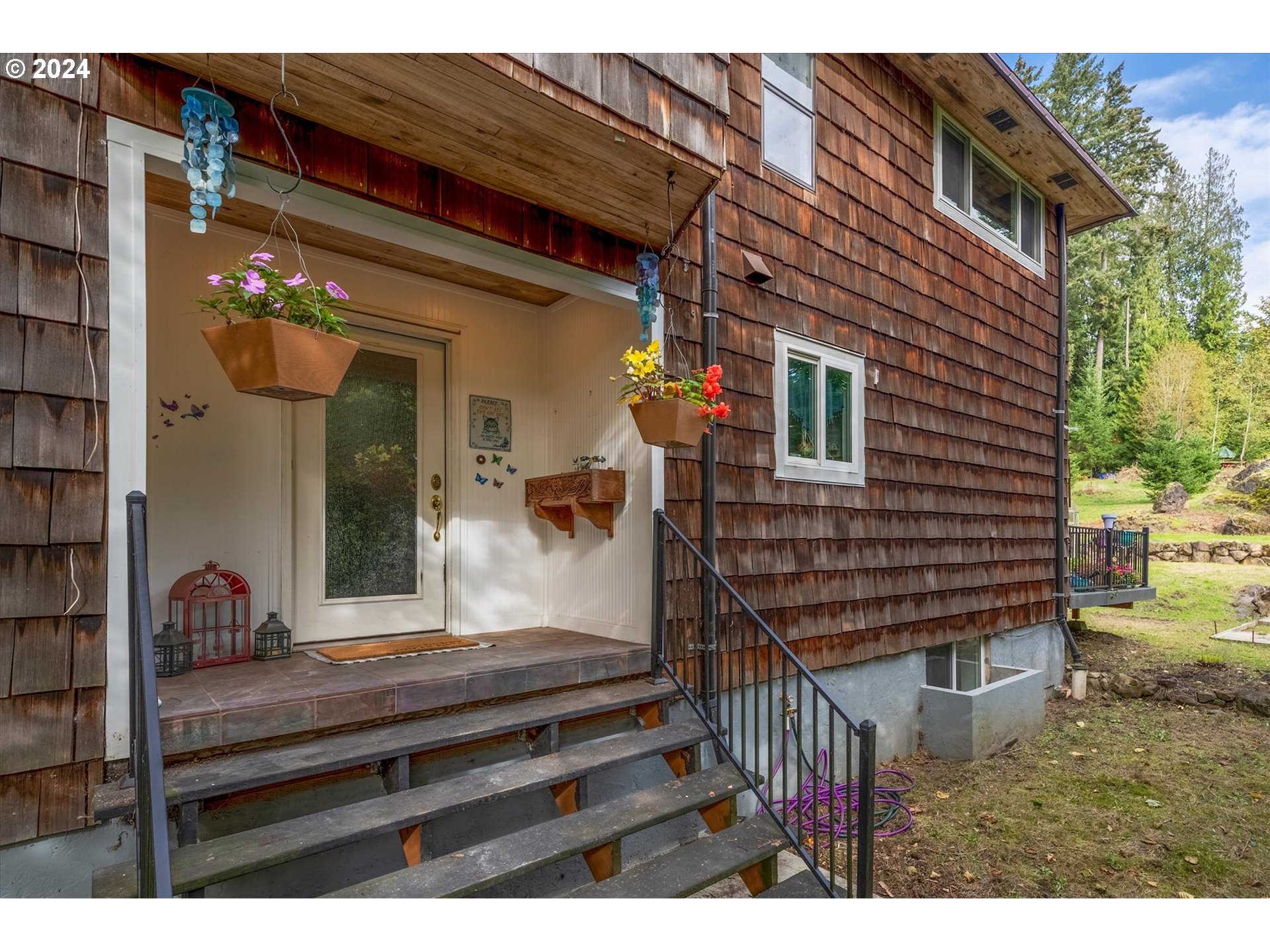 3516 Sunset Way Longview, WA 98632 - Photo 3 of 37 a view of a house with a wooden door and glass door