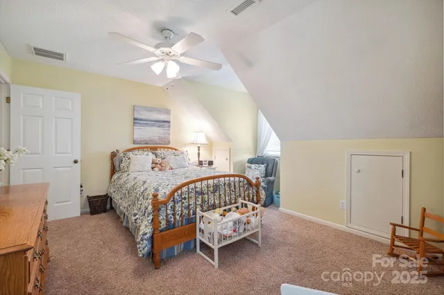 a spacious bathroom with a double vanity sink a mirror and a bathtub