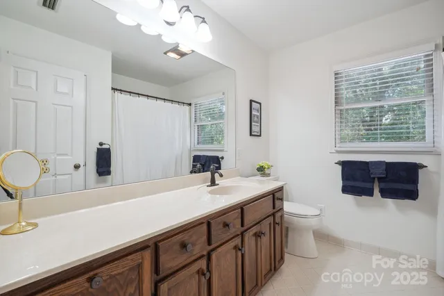 a kitchen with sink and cabinets