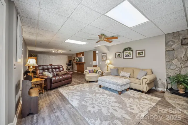 a bedroom with a bed and a television