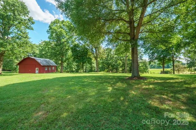 a view of a swimming pool with a yard
