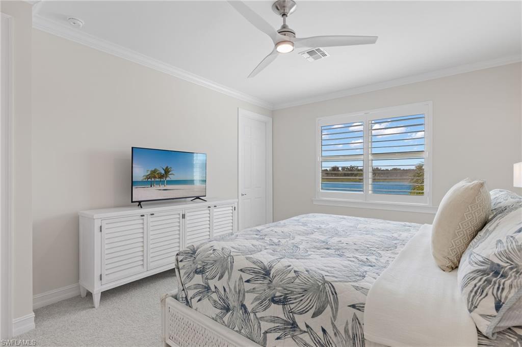 318 Deauville Loop Naples, FL 34114 - Photo 14 of 21 a bedroom with a bed and a television