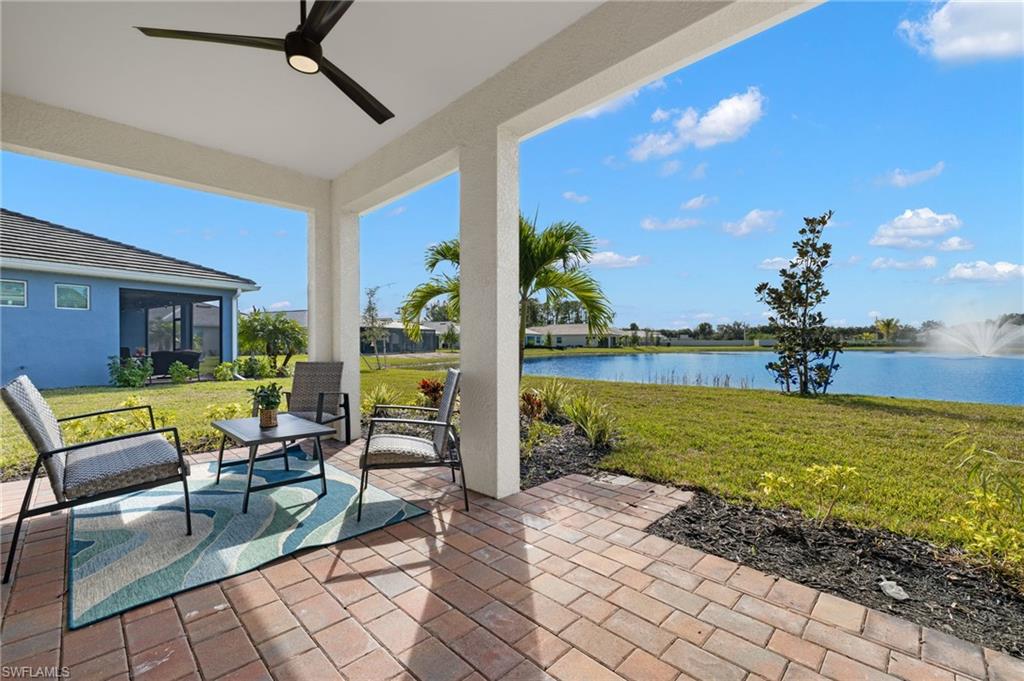 318 Deauville Loop Naples, FL 34114 - Photo 19 of 21 a building outdoor space with patio furniture and garden view