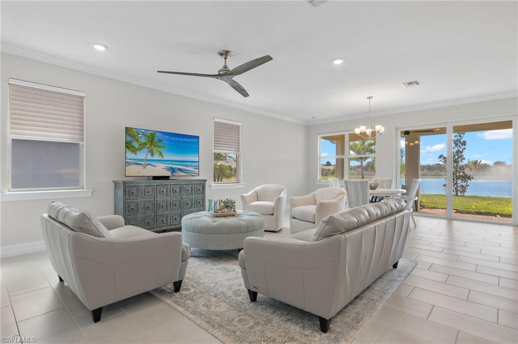 318 Deauville Loop Naples, FL 34114 - Photo 8 of 21 a living room with furniture and a large window