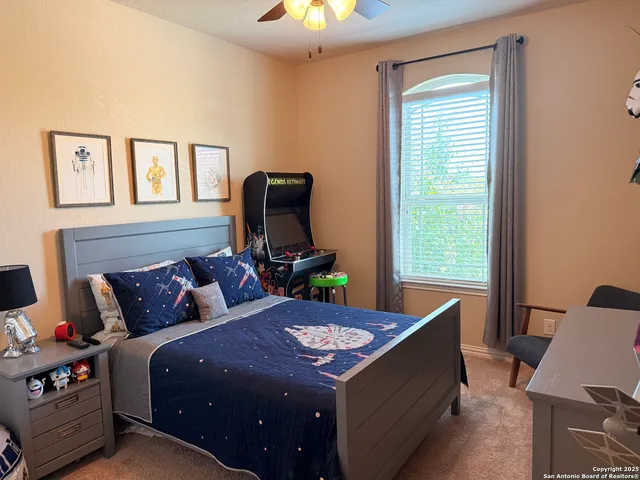 a bed room with furniture and a window