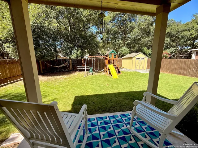 a view of an outdoor sitting area with furniture