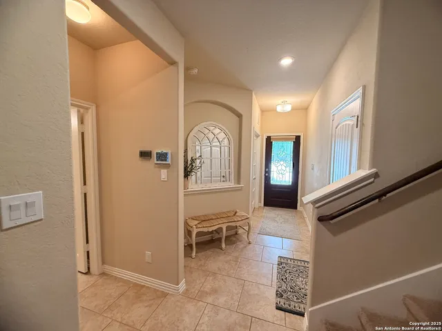 a view of a hallway with seating area