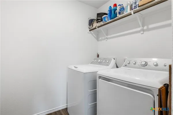 a utility room with dryer and washer