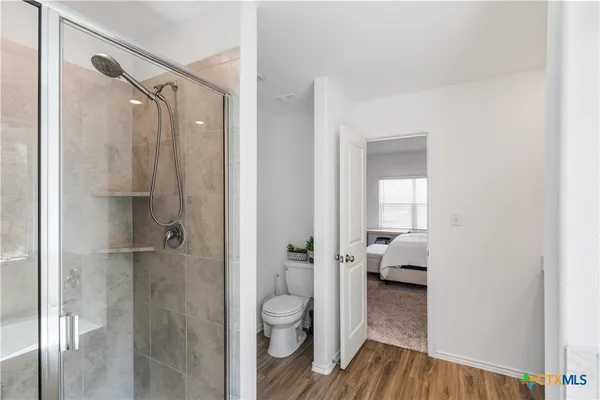 a bathroom with a sink and shower