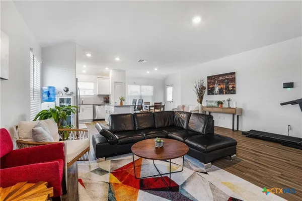a living room with furniture and a rug