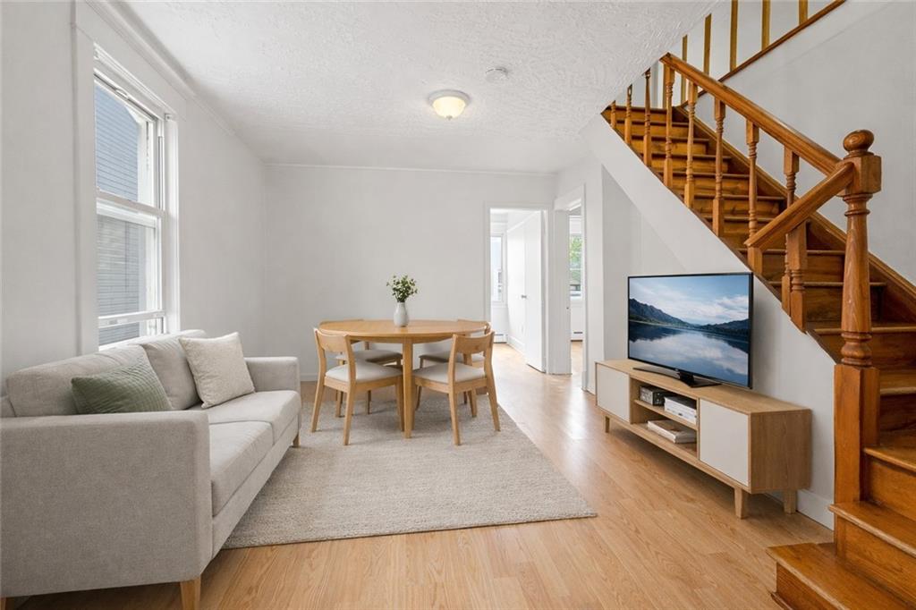 883 Manor Road Staten Island, NY 10314 - Photo 14 of 24 a living room with furniture and a flat screen tv