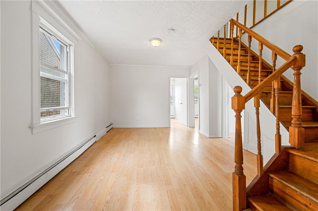 883 Manor Road Staten Island, NY 10314 - Photo 15 of 24 a view of entryway with stairs and wooden floor