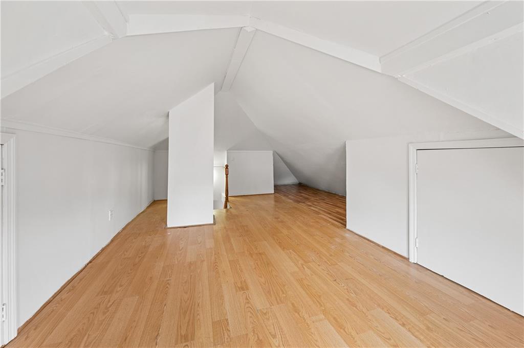 883 Manor Road Staten Island, NY 10314 - Photo 19 of 24 a view of empty room with wooden floor