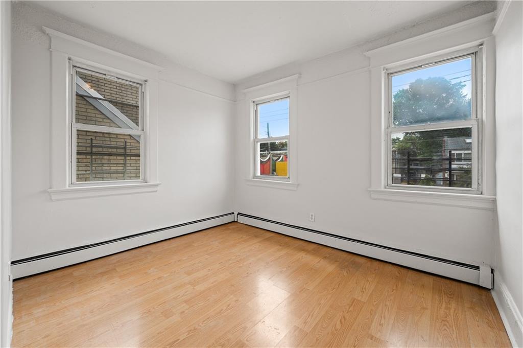883 Manor Road Staten Island, NY 10314 - Photo 8 of 24 a view of a room with blue walls and a window