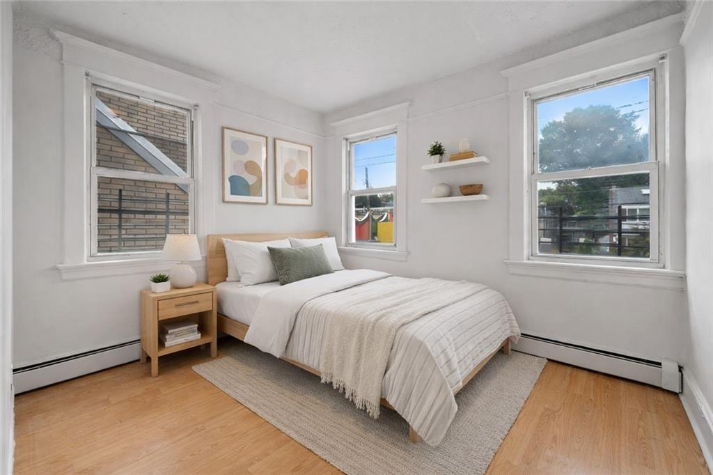 883 Manor Road Staten Island, NY 10314 - Photo 9 of 24 a bedroom with a bed and a window