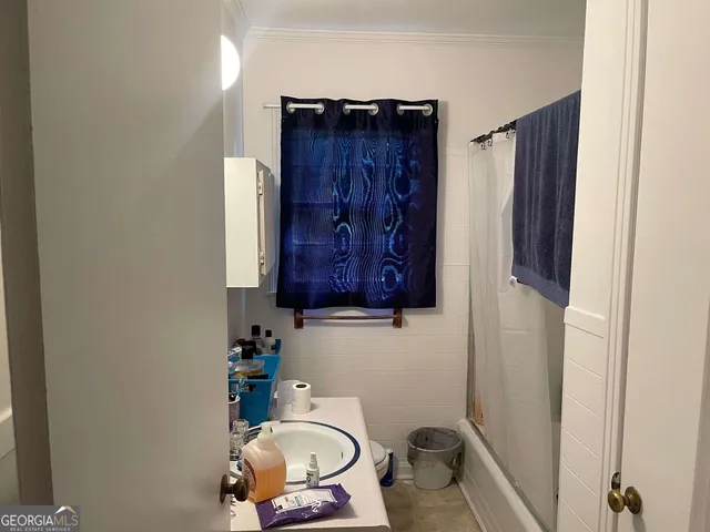 a bathroom with a sink and a toilet