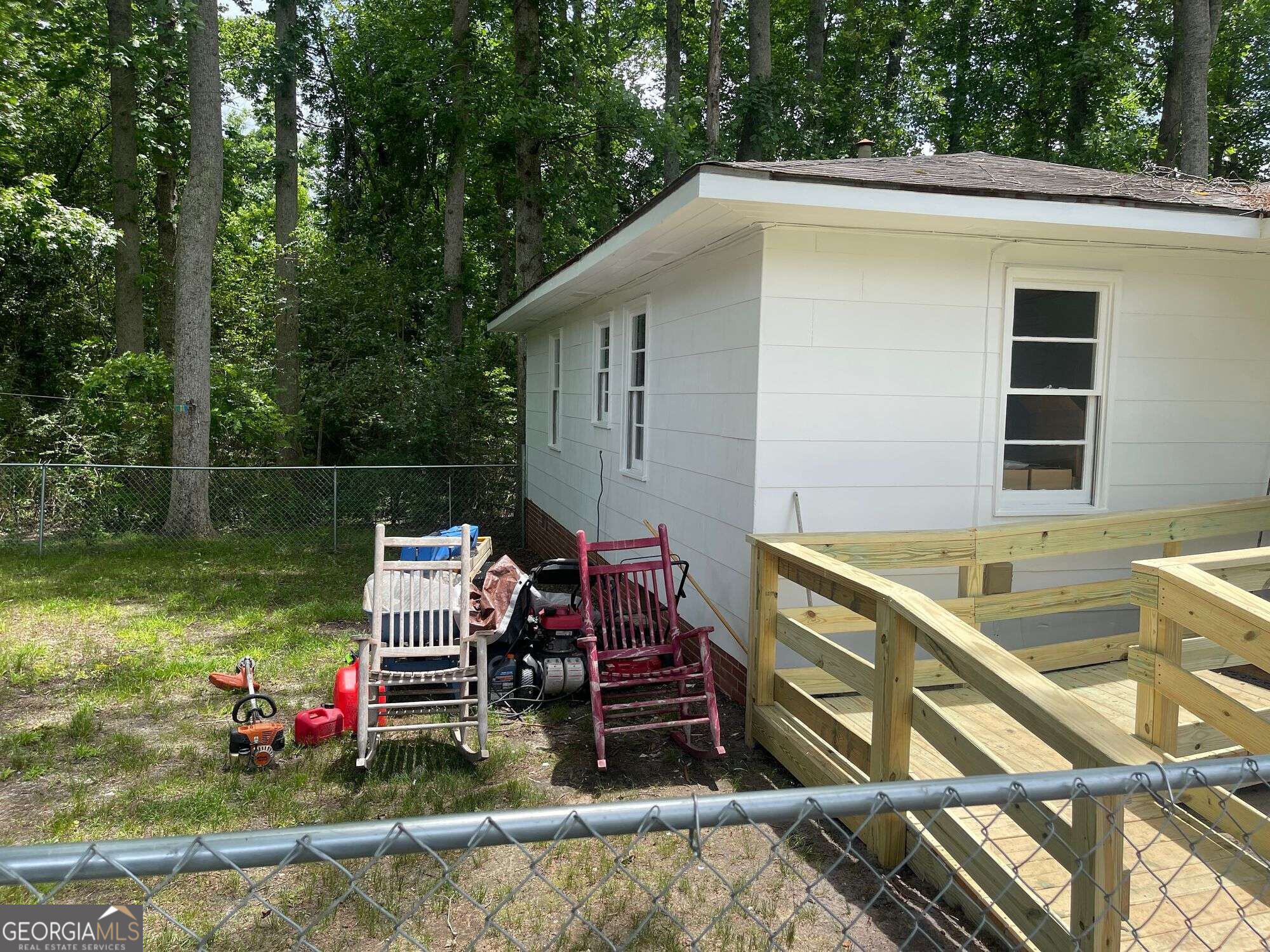 646 North Main Street Swainsboro, GA 30401 - Photo 2 of 27 a view of a chair and tables on the deck