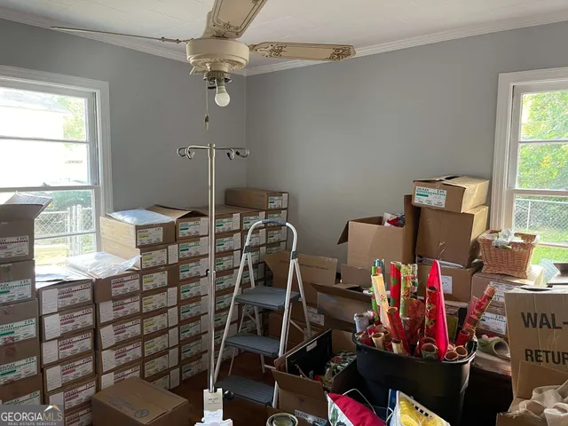 a room with gym equipment and a window