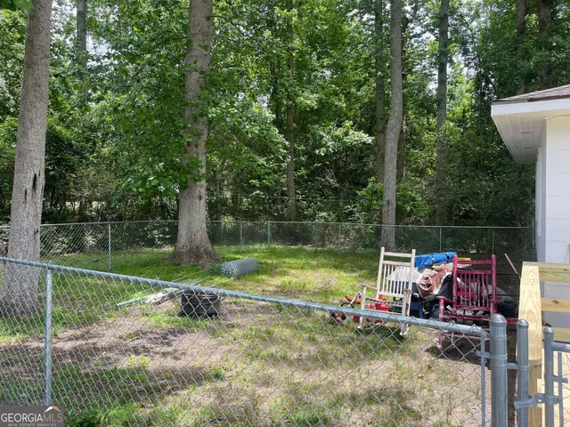 a view of back yard with green space