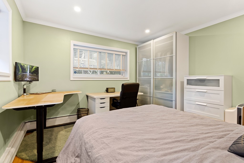 412 Langley Road, Unit 3 Newton, MA 02459 - Photo 20 of 30 a bedroom with a bed and a desk