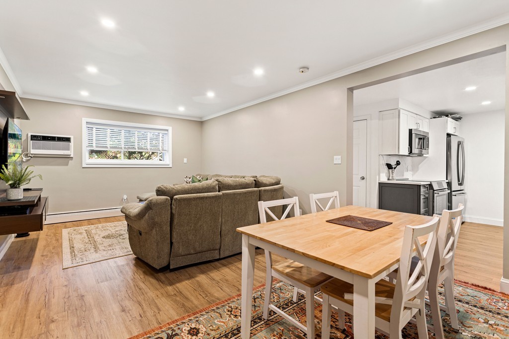412 Langley Road, Unit 3 Newton, MA 02459 - Photo 10 of 30 a living room with furniture and wooden floor