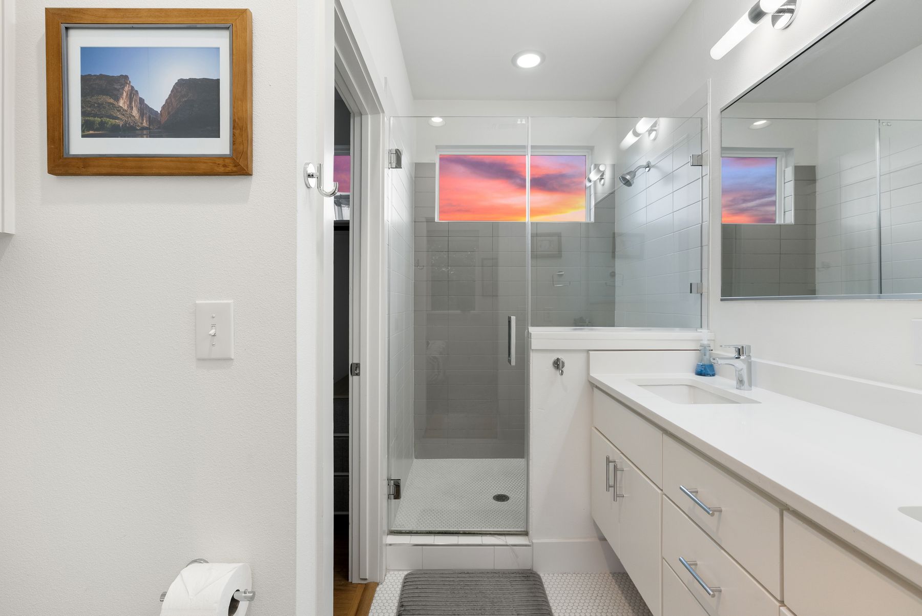 1709 Perez Street, Unit 2 Austin, TX 78721 - Photo 24 of 33 A well-appointed bathroom with a spacious glass-enclosed shower and modern double vanity.