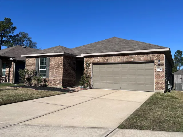 a front view of a house with yard