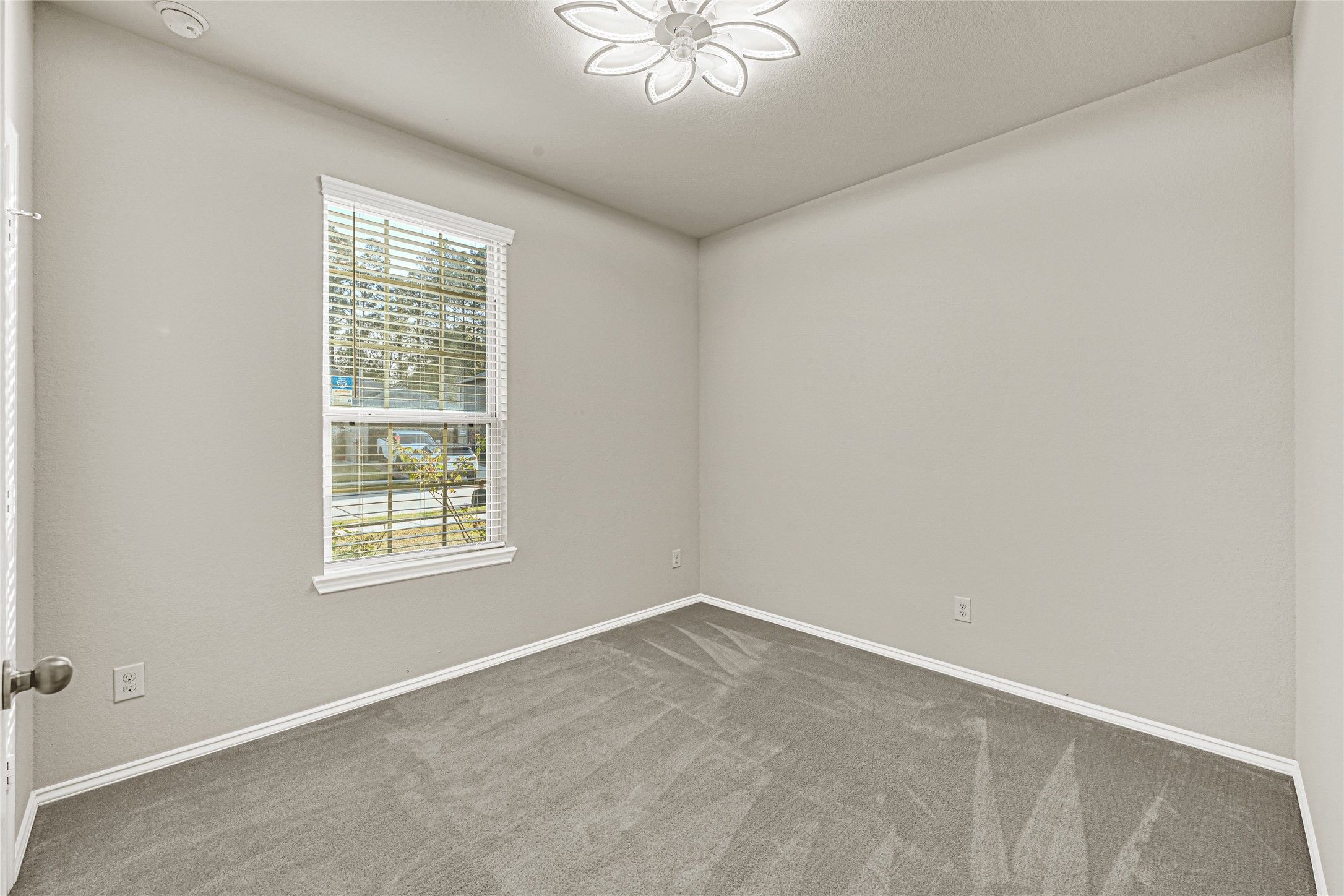 2210 Timberland Country Court Conroe, TX 77304 - Photo 15 of 25 an empty room with a window