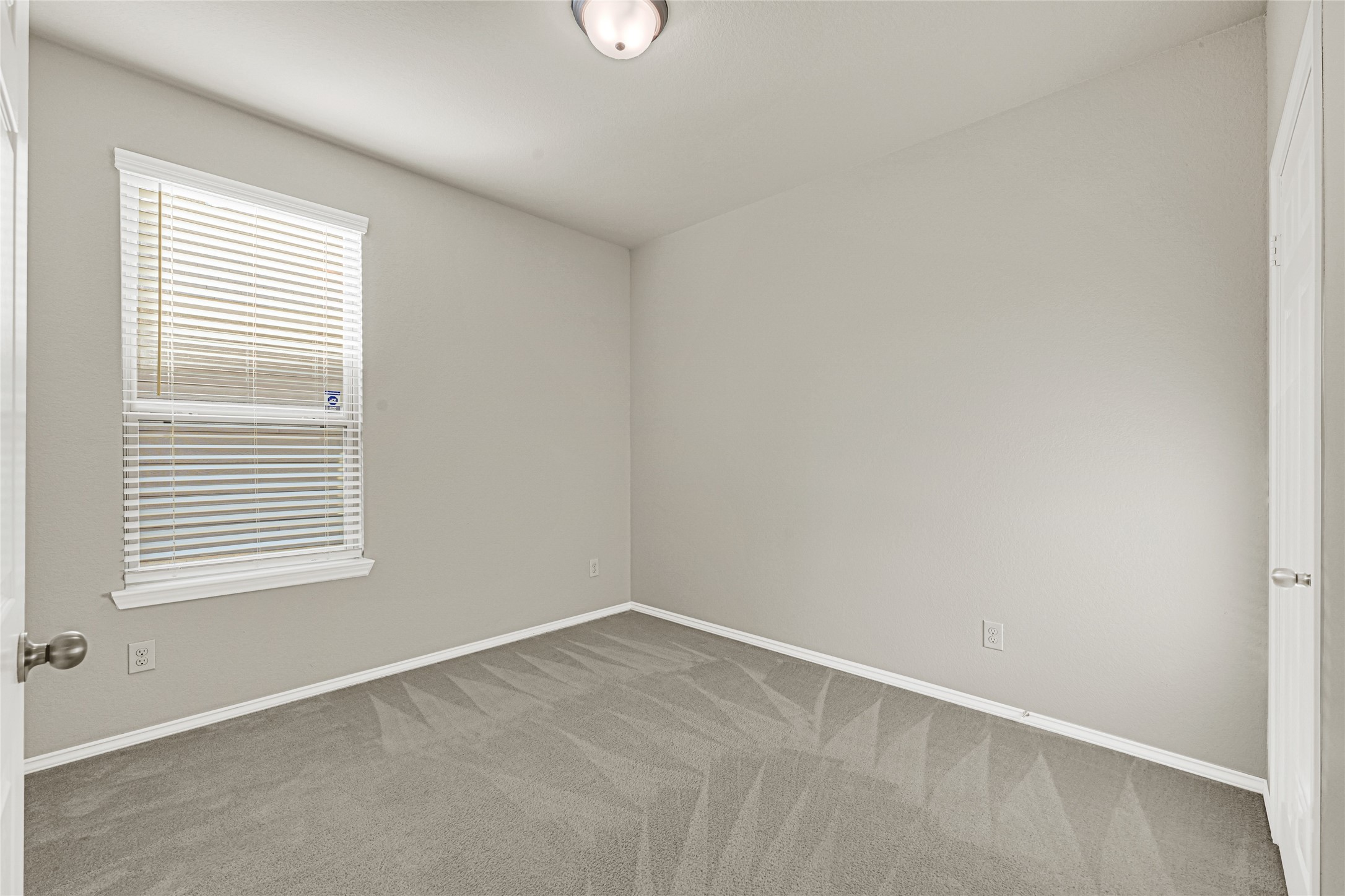 2210 Timberland Country Court Conroe, TX 77304 - Photo 16 of 25 an empty room with a window