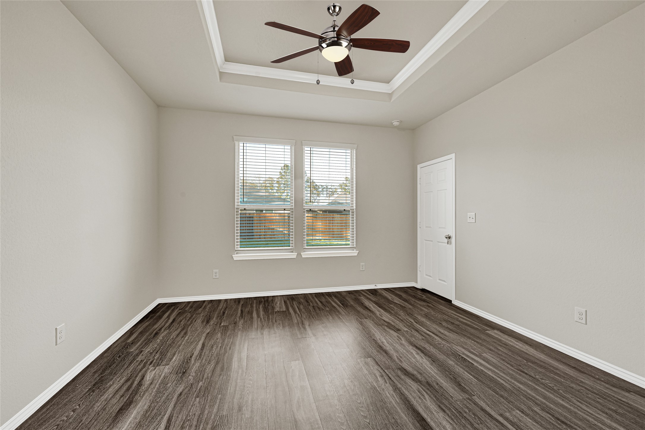 2210 Timberland Country Court Conroe, TX 77304 - Photo 19 of 25 wooden floor in an empty room with a window