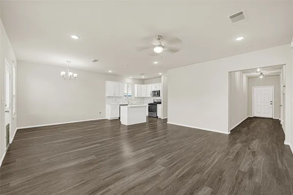 a view of kitchen with wooden floor and window