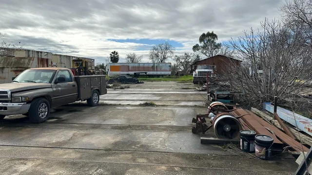 a view of parking area with parked cars