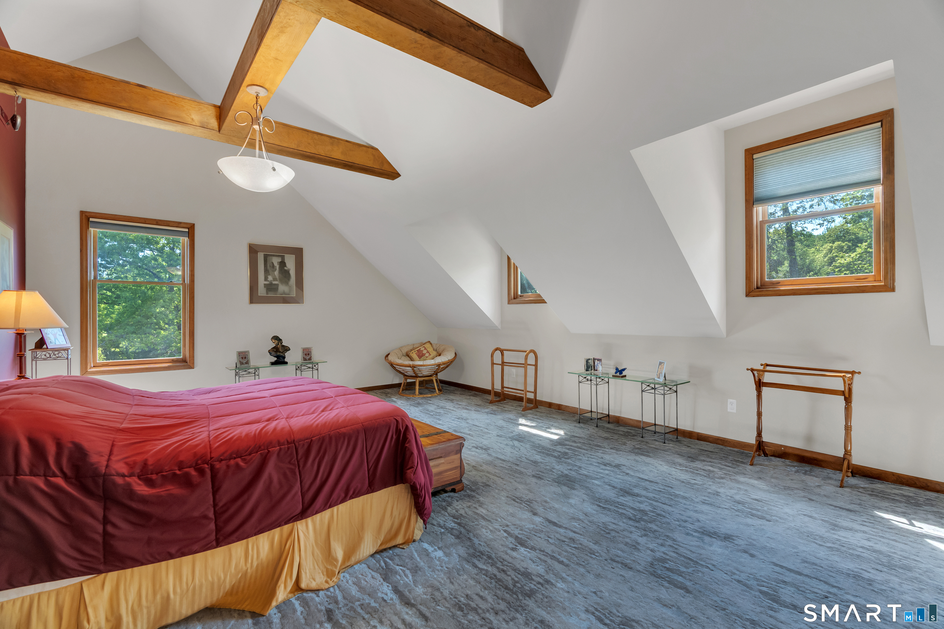 194 Quaker Farms Road Oxford, CT 06478 - Photo 20 of 40 a bedroom with a bed and wooden floor