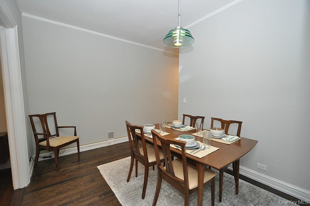 143 Garth Road, Unit 4P Scarsdale, NY 10583 - Photo 18 of 44 Updated Eat-In-Kitchen has Quartz counters and stainless steel appliances.