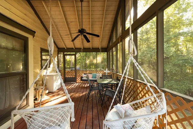 a view of living room with furniture and floor to ceiling window